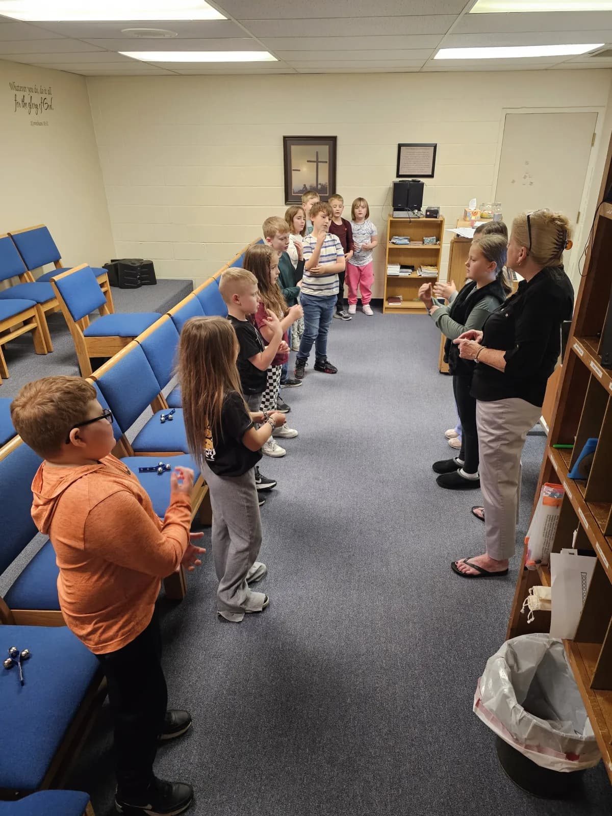 Students participating in music class led by the music teacher
