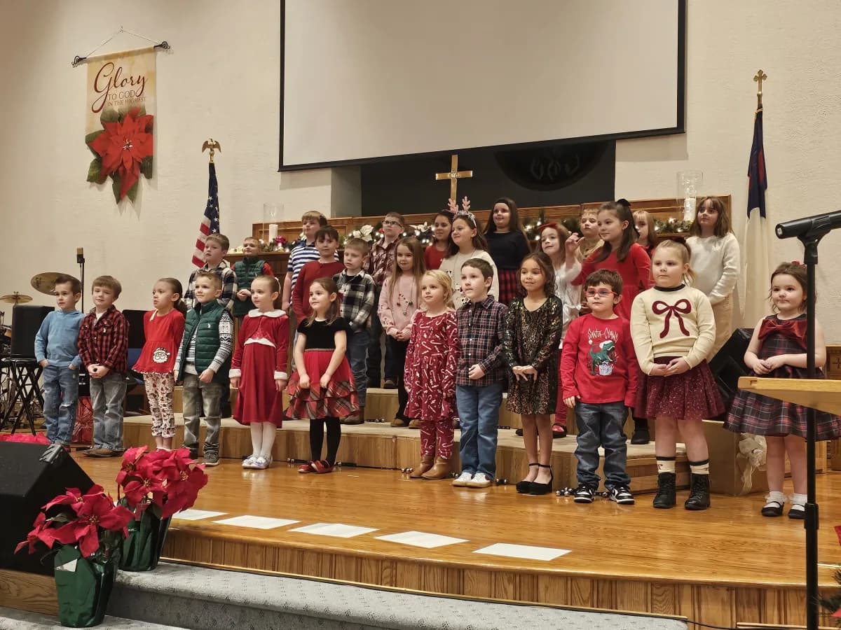 Students performing at the Christmas program on the church stage