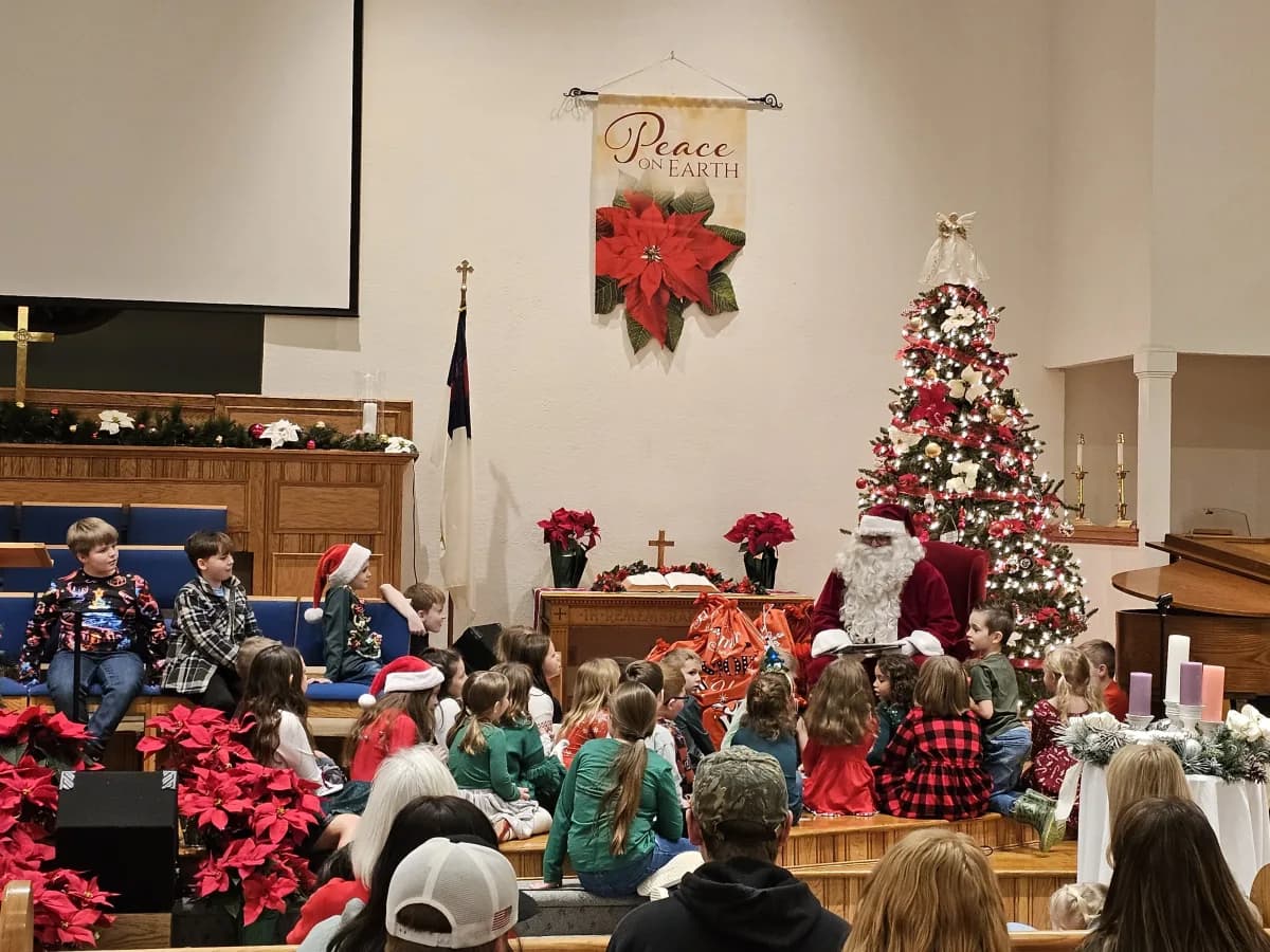 Students with Santa Claus during the Christmas celebration at church