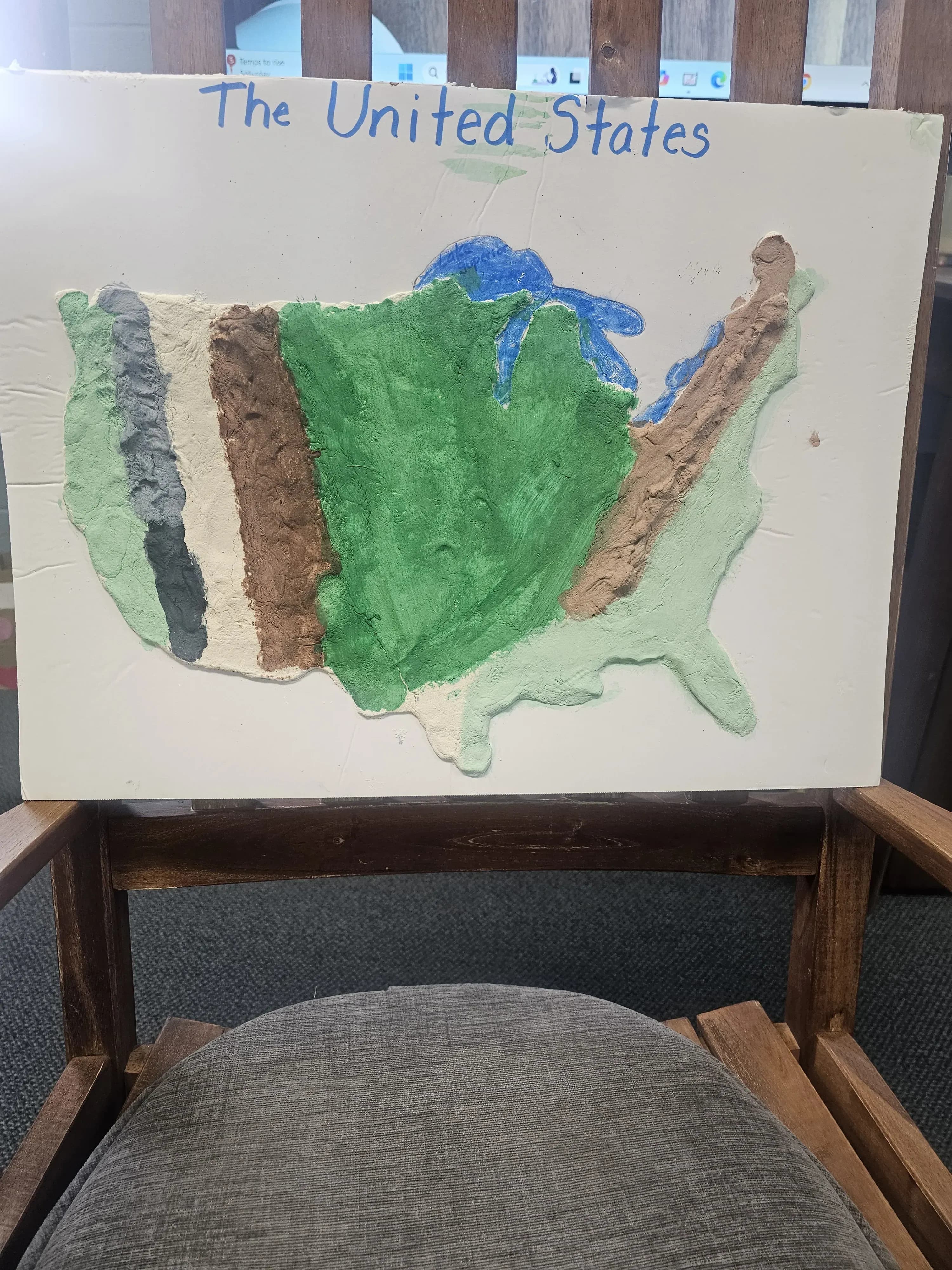 Student-created salt dough map of the United States painted with geographical features