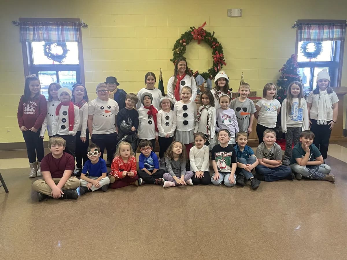 Students dressed as snowmen for the Christmas program